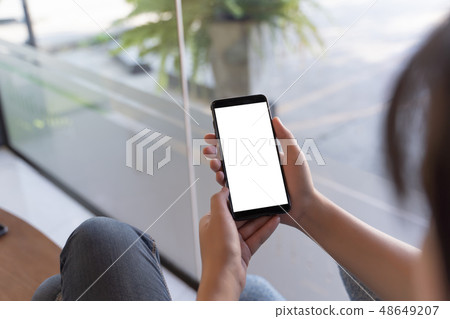 Woman using tablet Mockup for your own content  at 48649207
