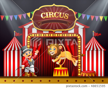 Cartoon lion jumping through ring on the stage 48651595
