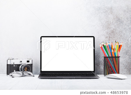 Loft home office workplace with laptop 48653978