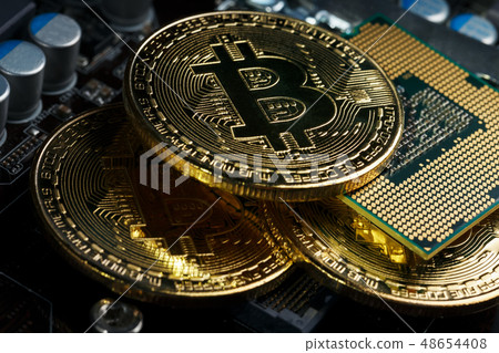 Golden Bitcoin Cryptocurrency on computer circuit 48654408