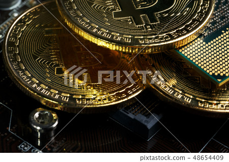 Golden Bitcoin Cryptocurrency on computer circuit 48654409