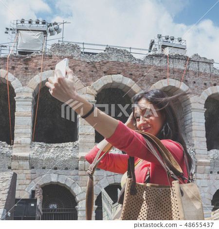 Tourist taking selfie photo Tourist taking selfie photo 48655437