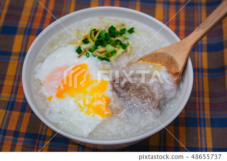 Rice porridge with soft boiled egg. Rice porridge with soft boiled egg. 48655737