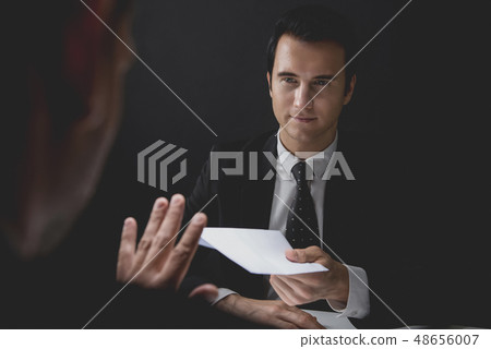 Businessman rejecting bribe money in white 48656007
