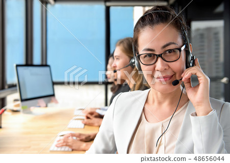 Asian woman manager working in call center Asian woman manager working in call center 48656044