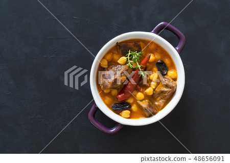 Harissa Lamb with chickpeas and apricots. Top view Harissa Lamb with chickpeas and apricots. Top view 48656091