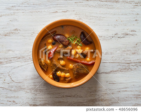 Harissa Lamb with chickpeas and apricots. Top view Harissa Lamb with chickpeas and apricots. Top view 48656096