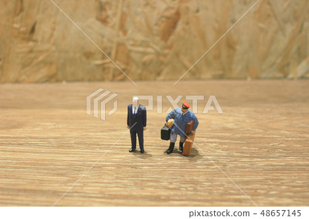 small of business figure at the table 48657145