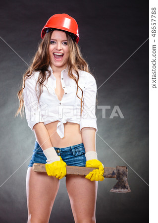 Sexy strong woman feminist with axe working. Sexy strong woman feminist with axe working. 48657788