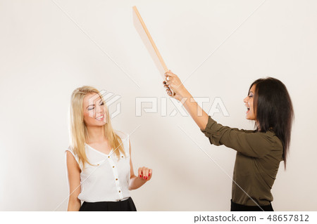 Women friends having fun blowing wind 48657812