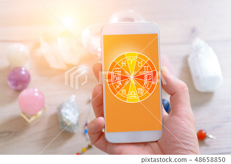 Modern astrology concept with mobile 48658850