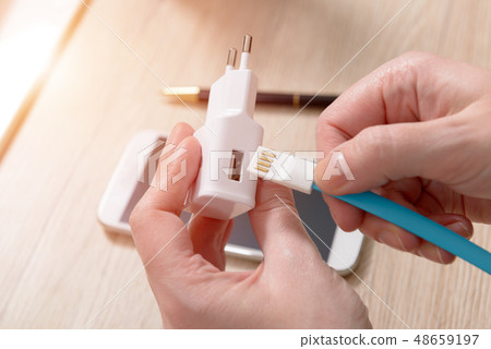 White charger with USB cable White charger with USB cable 48659197