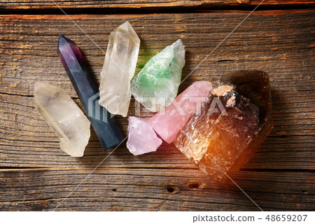 Multiple semi precious gemstones on board 48659207