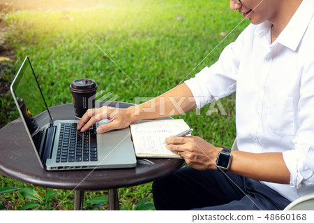 young buseness man work on the table with laptop young buseness man work on the table with laptop 48660168