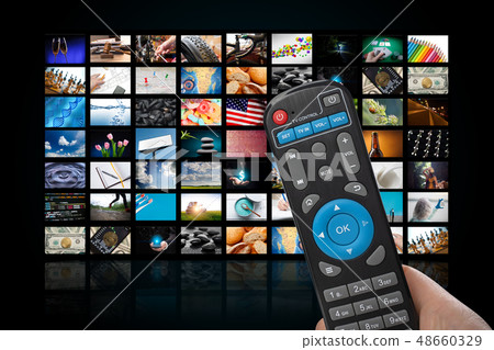 TV set with lot of pictures and hands of man with remote control. TV set with lot of pictures and hands of man with remote control. 48660329