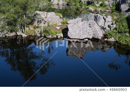 Mountain lake on the way to Preikestolen, Norway 48660903