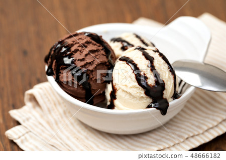 Bowl with tasty ice cream on table 48666182