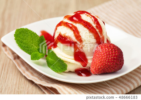 Bowl with tasty ice cream on table 48666183