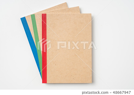 3 kraft notebook and pen on white background 3 kraft notebook and pen on white background 48667947