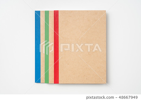 3 kraft notebook and pen on white background 48667949