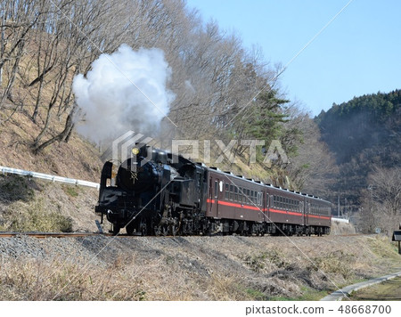 Steam locomotive in late winter Steam locomotive in late winter 48668700
