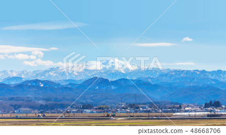 Distant view of Kaga plain and Buddhist mountains Hakusan (Nomi City, Ishikawa prefecture April) 48668706