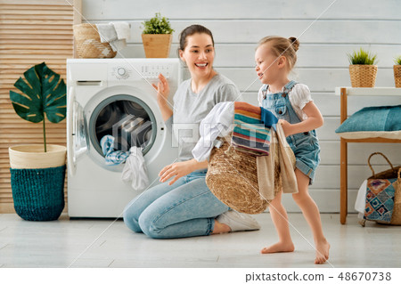 family doing laundry family doing laundry 48670738