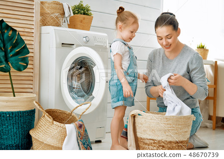 family doing laundry family doing laundry 48670739