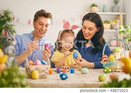 Family preparing for Easter Family preparing for Easter 48671023