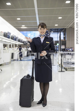 Cabin attendant at check-in counter 48673990