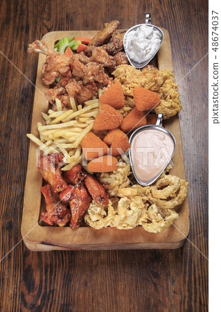 Assorted fried snacks 48674037