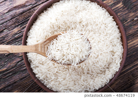 rice on a wooden background rice on a wooden background 48674119