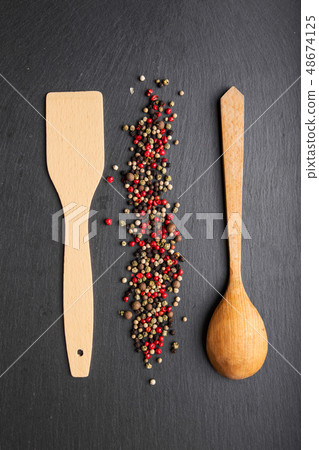 wooden spoon and spatula on slate, top view wooden spoon and spatula on slate, top view 48674125