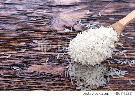 rice on a wooden background rice on a wooden background 48674128