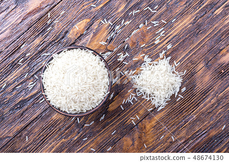 rice on a wooden background rice on a wooden background 48674130
