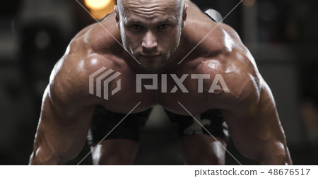 Handsome strong bodybuilder athletic men pumping Handsome strong bodybuilder athletic men pumping 48676517