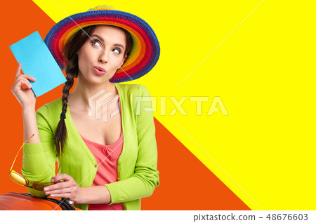 Woman tourist with travel suitcase and blue Woman tourist with travel suitcase and blue 48676603