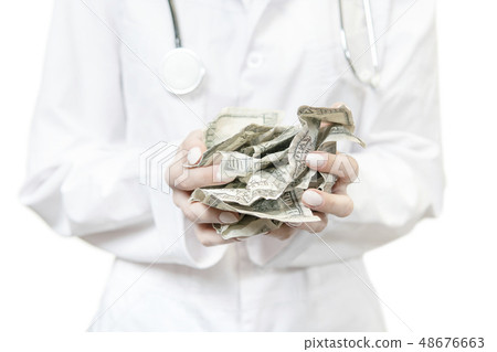 doctor holding crumpled money doctor holding crumpled money 48676663