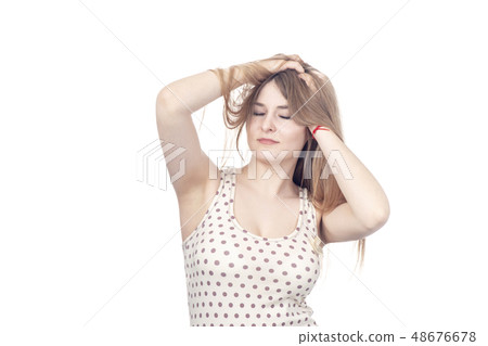 beautiful woman ruffles hair 48676678