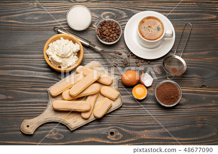 Ingredients for cooking tiramisu - Savoiardi biscuit cookies, mascarpone, cream, sugar, cocoa 48677090