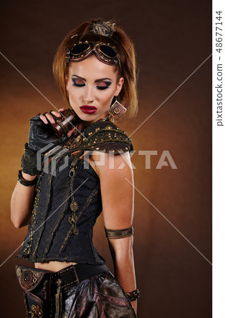 Steampunk woman over gunge background. . Fantasy 48677144
