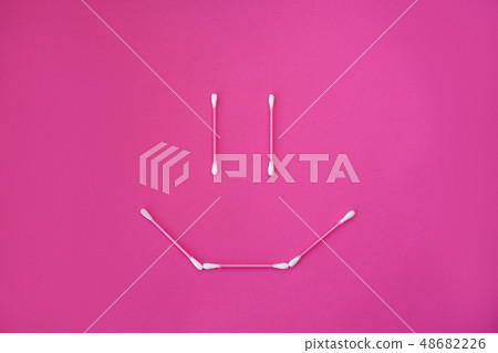 top view on pink cotton buds with white heads laid top view on pink cotton buds with white heads laid 48682226
