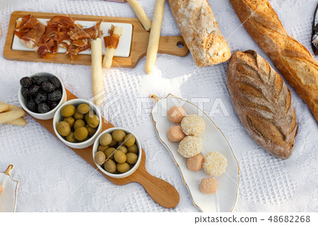 Food lay out on picnic blanket. fresh baked bread, Food lay out on picnic blanket. fresh baked bread, 48682268