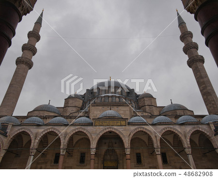 Arches and domes of a mosque with two minarets 48682908