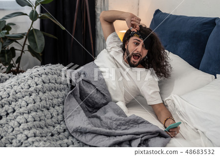 Stressed young man realizing that he is late 48683532