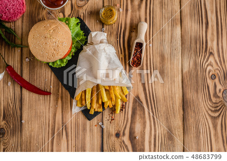 Tasty hamburger with meat and vegetables  48683799