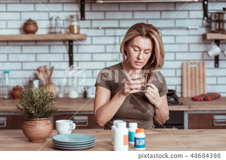 Stressed wife taking sleeping pills committing suicide Stressed wife taking sleeping pills committing suicide 48684398
