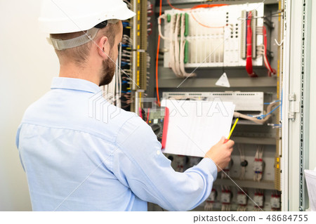 Professional electrician in hardhat Professional electrician in hardhat 48684755
