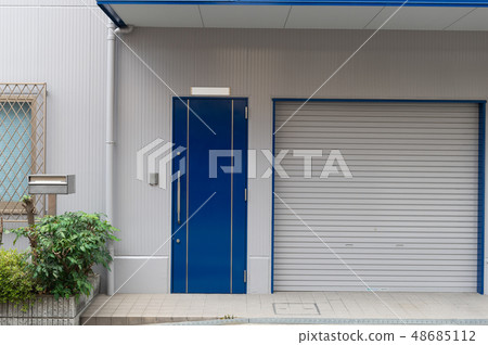 sidewalk by street wall & door sidewalk by street wall & door 48685112