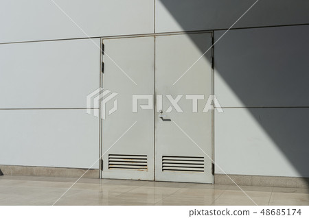 sidewalk by street wall & door sidewalk by street wall & door 48685174